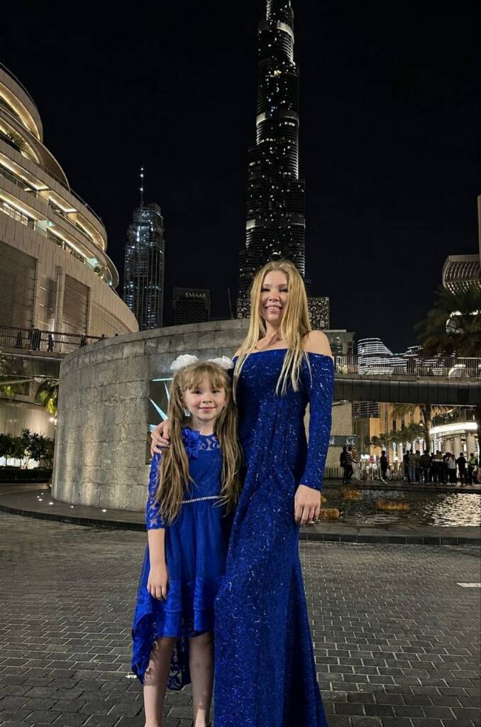 Client in a bespoke sapphire gown at night in Downtown Dubai