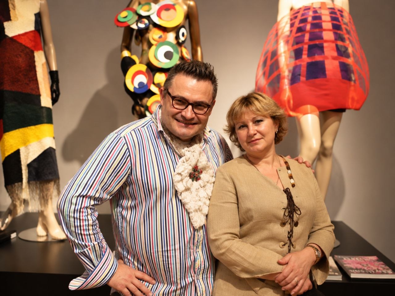 Lyubov Borovskih with fashion historian Alexander Vasiliev in a classroom at ESMOD Dubai, with mannequins in avant-garde outfits, 2012